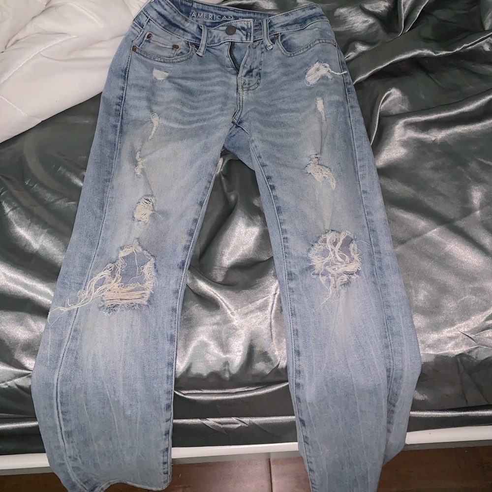 Blue ripped jeans.